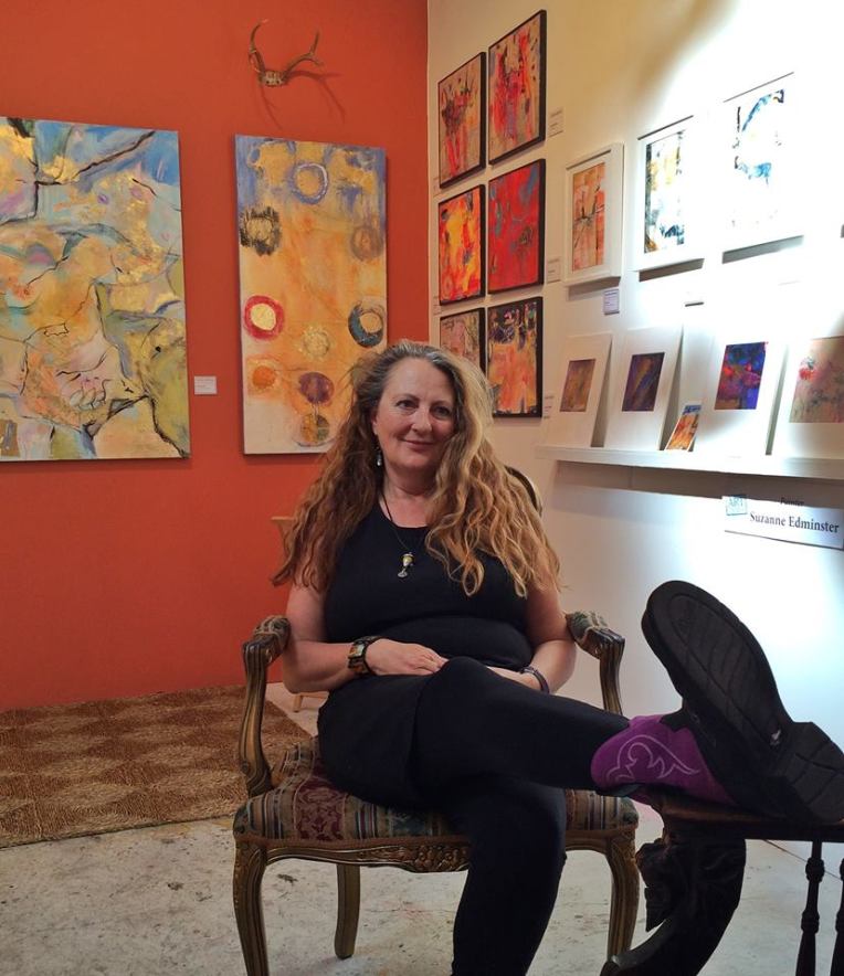 Orange wall, purple boots, and an open studio
